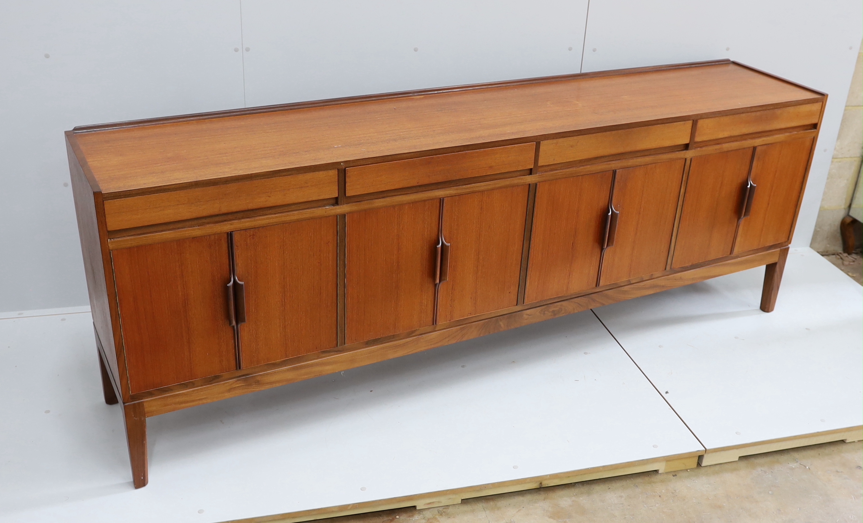 Robert Heritage for Archie Shine, a mid century teak sideboard, length 238cm, depth 46cm, height 86cm